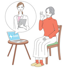 スマートフォンでオンライン診療を受けるシニア女性