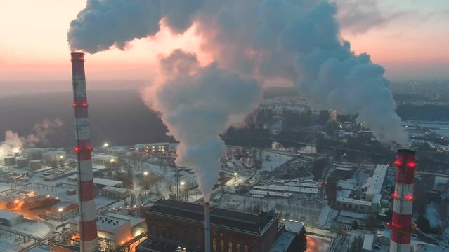 Aerial view of heating plant and thermal power station. Combined modern power station for city district heating and generating electrical power. Industrial zone from above.