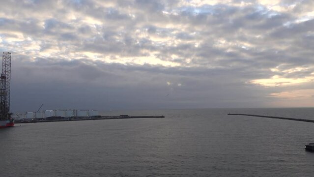 Frederikshamn, Denmark A passenger and car ferry leaves the harbor on a cloudy day bound for Gothenburg, Sweden. 