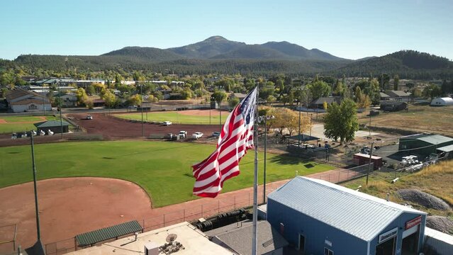 Close up of USA flag at baseball diamond in town of Williams Arizona