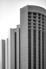 Black and White Skyscrapers against Bright Sky.