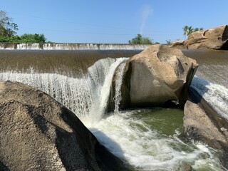 The view of the water in the dam during the dry season with its rocks is very beautiful