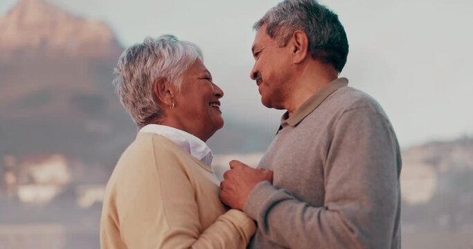 Love, dance and happy senior couple at a beach for retirement, vacation and travel freedom together. Smile, romance and old people dancing, laugh and bond in nature on ocean trip in South Africa