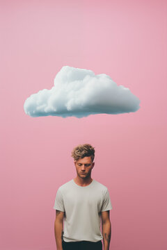 sad man with cloud floating over head, isolated on plain pink studio background