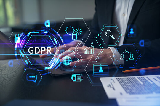 Businesspeople typing on laptop at office workplace. Concept of team work, business education, internet surfing, brainstorm, project information technology. Hands shot. GDPR hologram