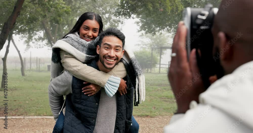 Wall mural couple, piggyback and photographer at park to take picture, bonding and smile on holiday in winter f