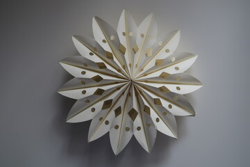 origami craft papersnowflakes in scandinavian style, winter decoration, swedish style decor