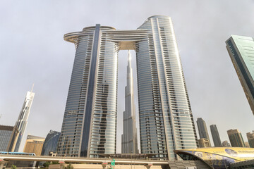 View from the window of a tourist bus on the Address Sky View hotel and the Burj Khalifa building...