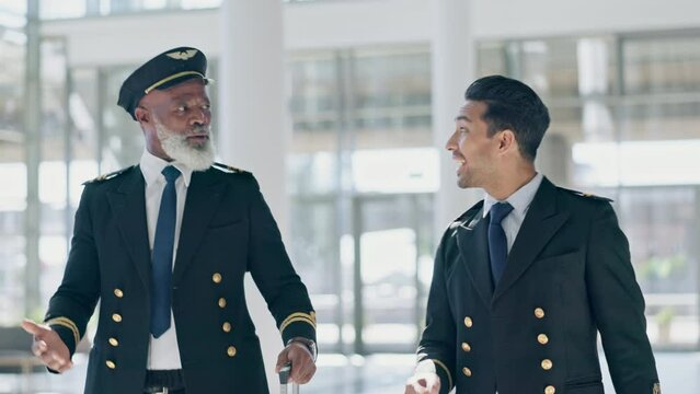 Pilot, mentor and senior man with colleague in airport walking, talking and enjoy planning, conversation and strategy discussion. Airplane, men and elderly male captain intern before boarding flight