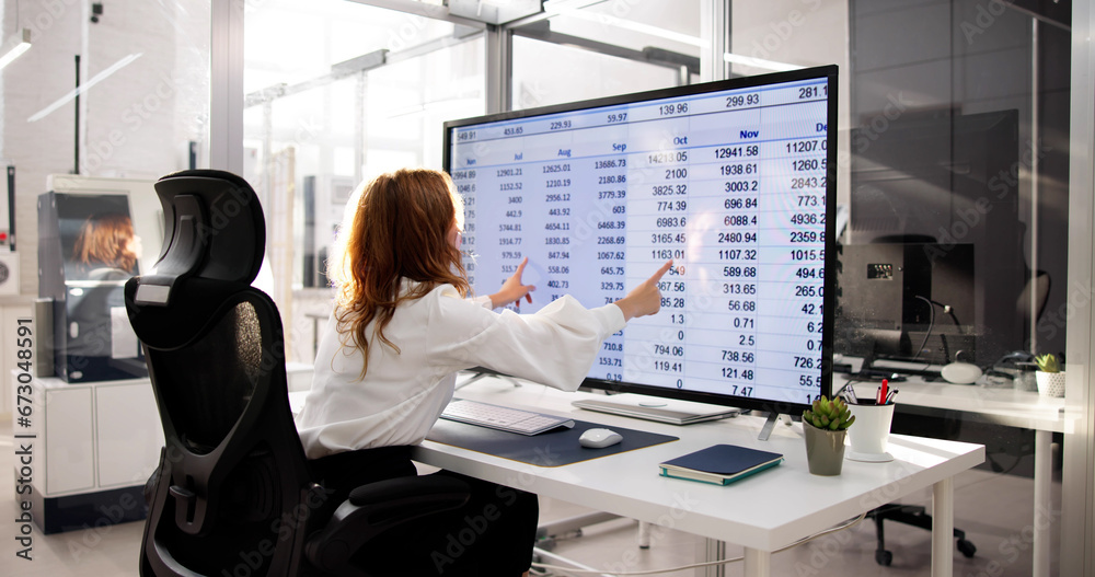 Poster analyst working with spreadsheet business data