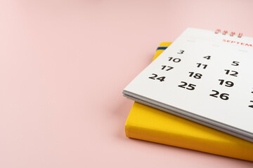 close up of calendar on the colorful pink table background, planning for business meeting or travel...