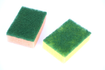 Soft cleaning sponge for washing dishes, isolated in white background. Concept, useful equipment...