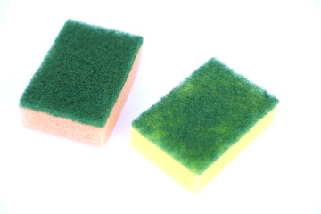 Soft cleaning sponge for washing dishes, isolated in white background. Concept, useful equipment for cleaning, scrubbing dish in kitchen or use for other purposes. Household tool.                     