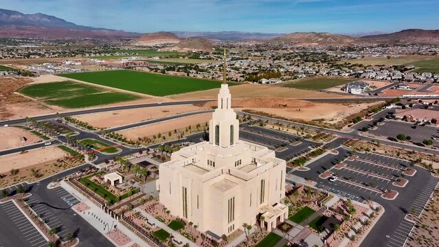 Aerial LDS Red Cliff Temple St George Utah day pull. Red Cliff Temple, The Church of Jesus Christ of Latter-day Saints, LDS or Mormon religion. Eternal family ordnances. Beautiful sacred building.