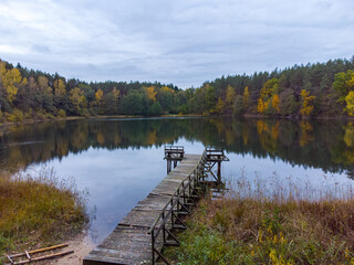 Autumn evening by the lake,old wooden bridge.