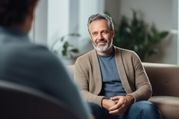 Caucasian man at an appointment with a psychologist. - obrazy, fototapety, plakaty