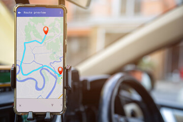 A mobile phone with GPS map navigation in a car.