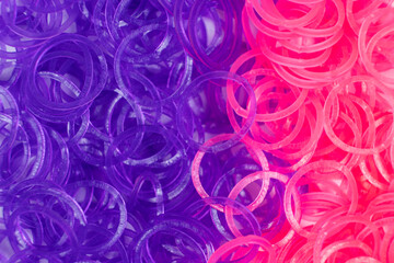 Pink and purple elastic bands for weaving bracelets for girls - obrazy, fototapety, plakaty