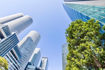 都市イメージ　名古屋駅前の高層ビル群と新緑 - obrazy, fototapety, plakaty