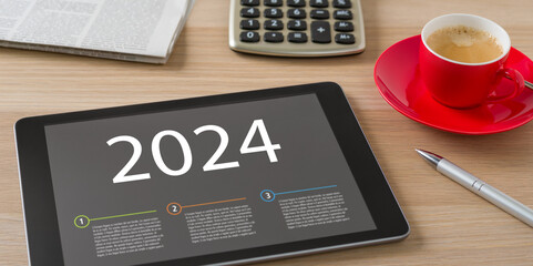 A tablet with the headline 2024 - obrazy, fototapety, plakaty