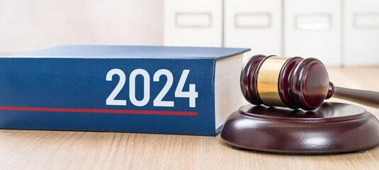 A law book with a gavel - 2024 - obrazy, fototapety, plakaty