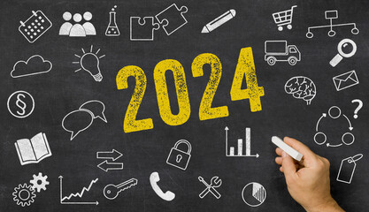 2024 written on a blackboard with icons