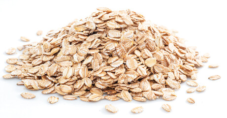 Pile of wheat flakes isolated on white background.