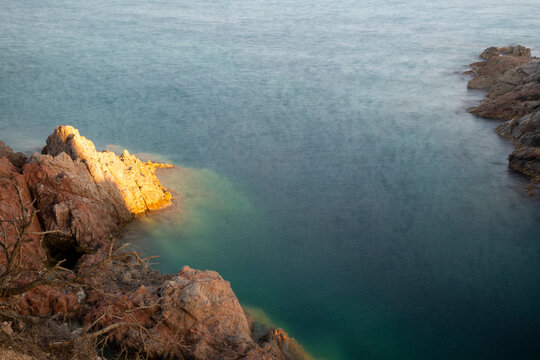 the sea crashing against the rocks