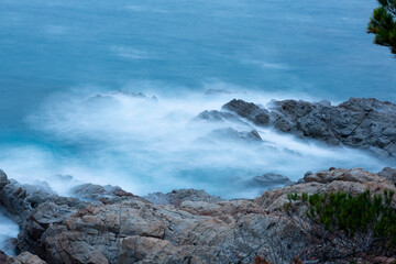 the sea crashing against the rocks