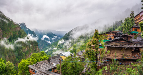 Panoramic view of Jakha, It is a small village also called hangining village because it looks hanging on the Himalayas mountains enroute Rupin Pass trail in Shimla district of Himachal Pradesh, India. - obrazy, fototapety, plakaty
