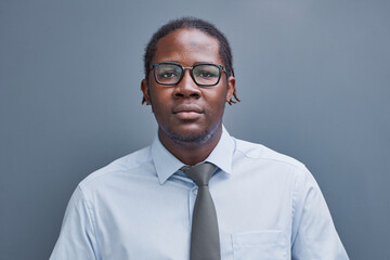 portrait of afro american young man on gray background