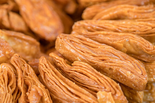 Khaja snacks layered fritters dunked In sugar syrup, for sale in puri odisha india.