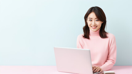 Naklejka premium use laptop japan Asian pink colored background.woman with laptop