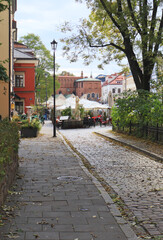 A sunny autumn street leading to The Old Synagogue Kazimierz neighbourhood in Kraków