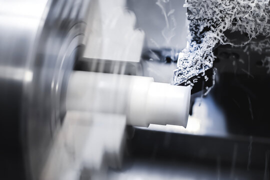 The work of a CNC lathe on a workpiece made of textolite or propylene. Automation of the production base