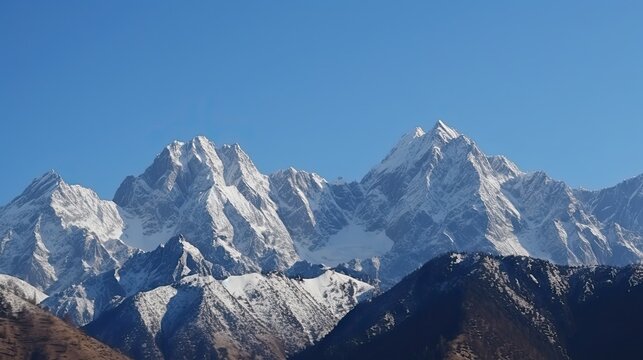 Fototapeta Snow-Capped Mountain Panorama: White Peaks and a Blue Sky