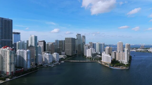 Aerial perspective shot of impressive metropolitan along waterfront in Miami. Trendy Brickell neighbourhood with financial centers and exclusive condominiums