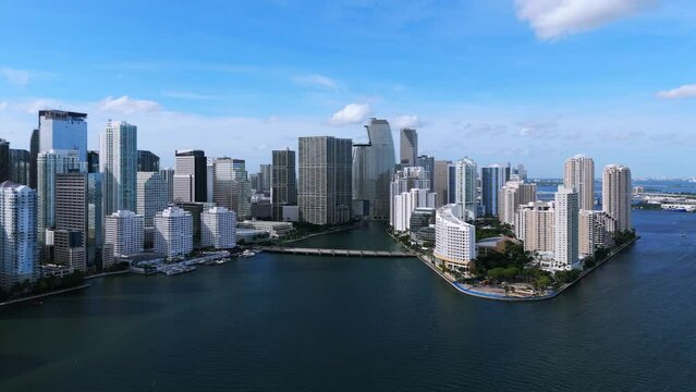 Breathtaking wide view of futuristic waterfront buildings on human-made Cloughton island and mainland in Miami. Brickell Key providing amenities and luxuries of urban living