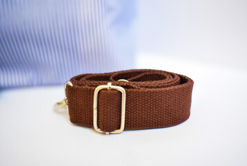 The combination of fabric and metal buckles enhances the sense of durability and style.
