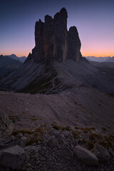 Evening landscape after sunset in the Italian Dolomites. Vertical view of Tre Cime di Lavaredo. Blue hour in the mountains