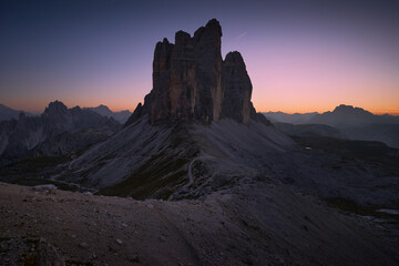 Evening landscape after sunset in the Italian Dolomites. Panoramic view of Tre Cime di Lavaredo. Blue hour in the mountains - obrazy, fototapety, plakaty
