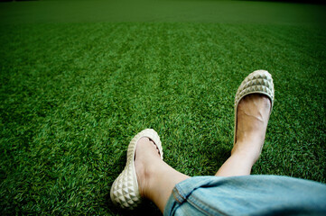 Sitting leisurely on the grass