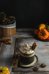 pumpkin latte with cinnamon and pumpkins