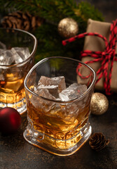 Two glasses of whiskey with ice