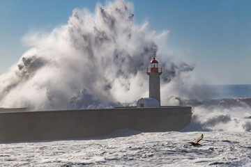 Storm waves over the Lighthouse - obrazy, fototapety, plakaty