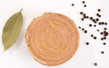 piece of beef pork liver pate on the white background with peppers