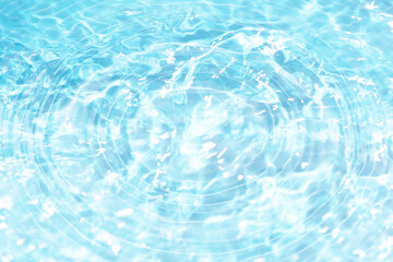 Defocus blurred transparent blue colored clear calm water surface texture with splashes reflection....