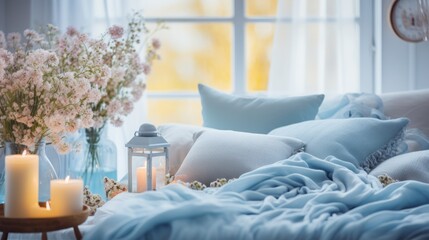 A bedroom's evening ambiance is enhanced with soft candles and a vase of inviting flowers.