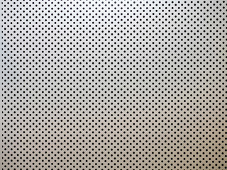 Perforated steel sheet. Industrial background. Sheet metal with identical round holes. Industrial...