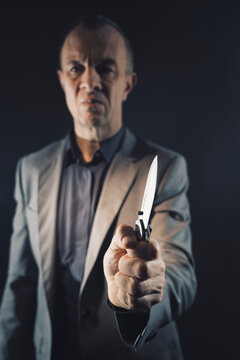 Assassin murderer killer holding knife weapon
